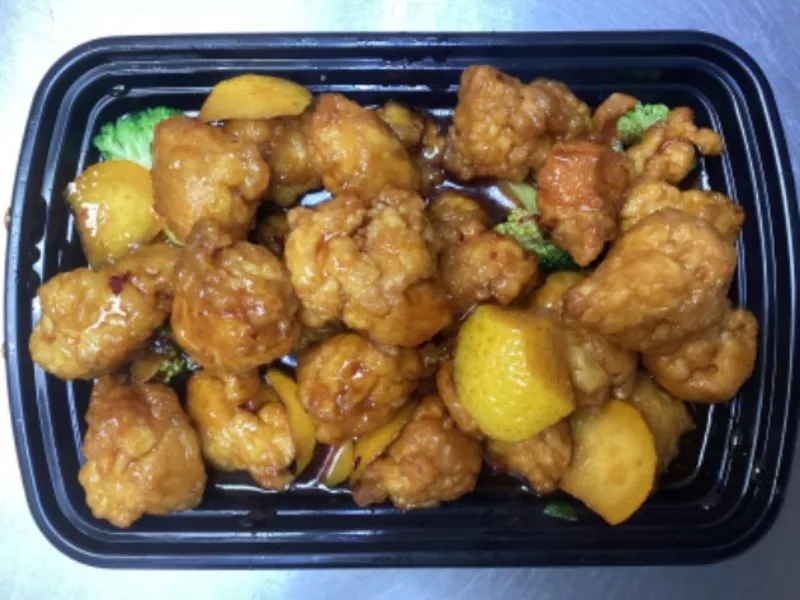 Orange chicken with orange slices at China Panda, an Chinese Restaurant in Dallas